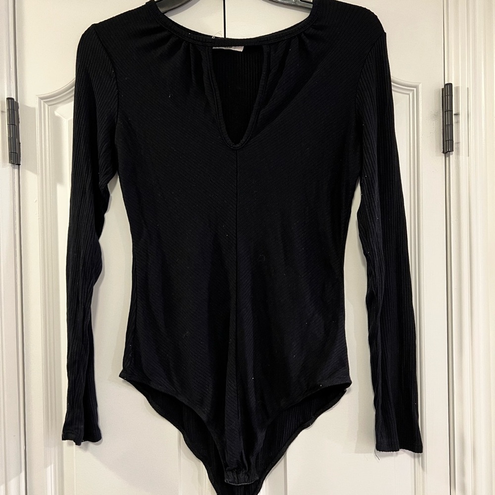 Black long sleeve bodysuit with cutout detail